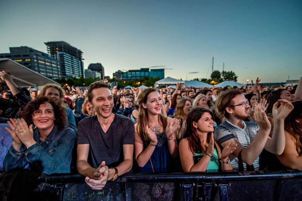 Festival crowd enjoying an outdoor electronic music event in Halifax.