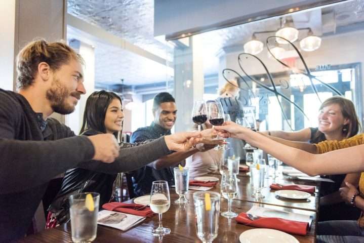 Group and restaurant server on a Nova Scotia wine tour
