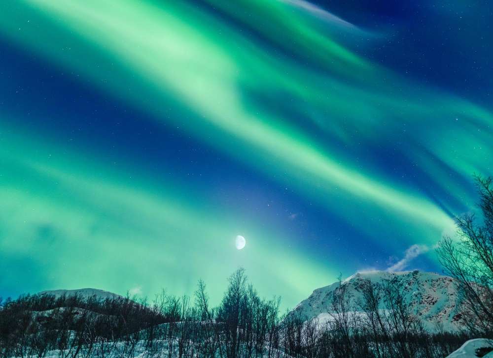 Visitors hiking to remote aura hotspots in northern Canada.