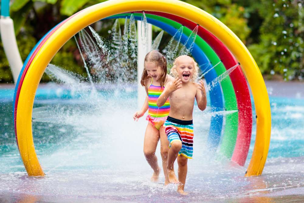 Children enjoying clean water play at a summer splash park in Nova Scotia.