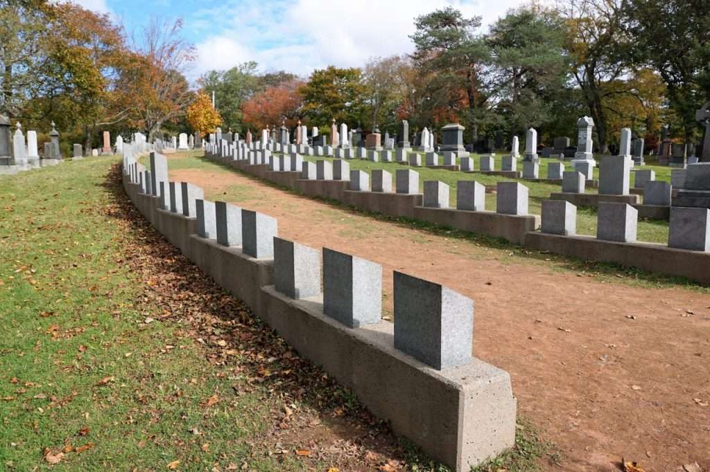 Curved rows of Titanic headstones at Fairview Lawn Cemetery Halifax