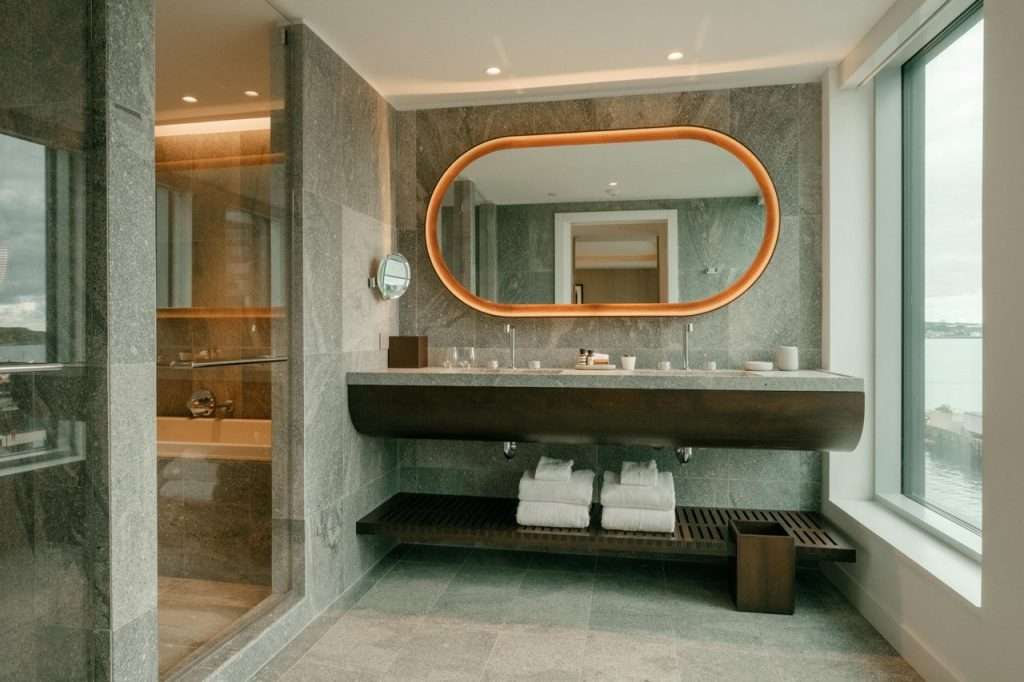 Muir Luxury Collection Hotel Halifax bathroom with a double vanity and waterfront view